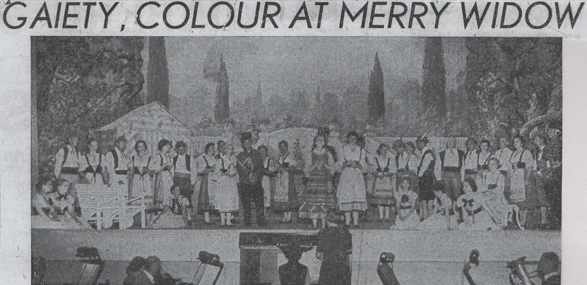 The Merry Widow newspaper clipping with photo depicting cast on stage described as gaiety colour at Merry Widow